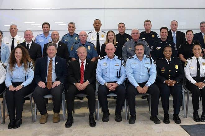 A visiting group of the Israel Police for the Georgia International Law Enforcement Exchange meets with Avshalom Peled, deputy Israeli police commissioner (center, front row). Credit: Israel Police.
