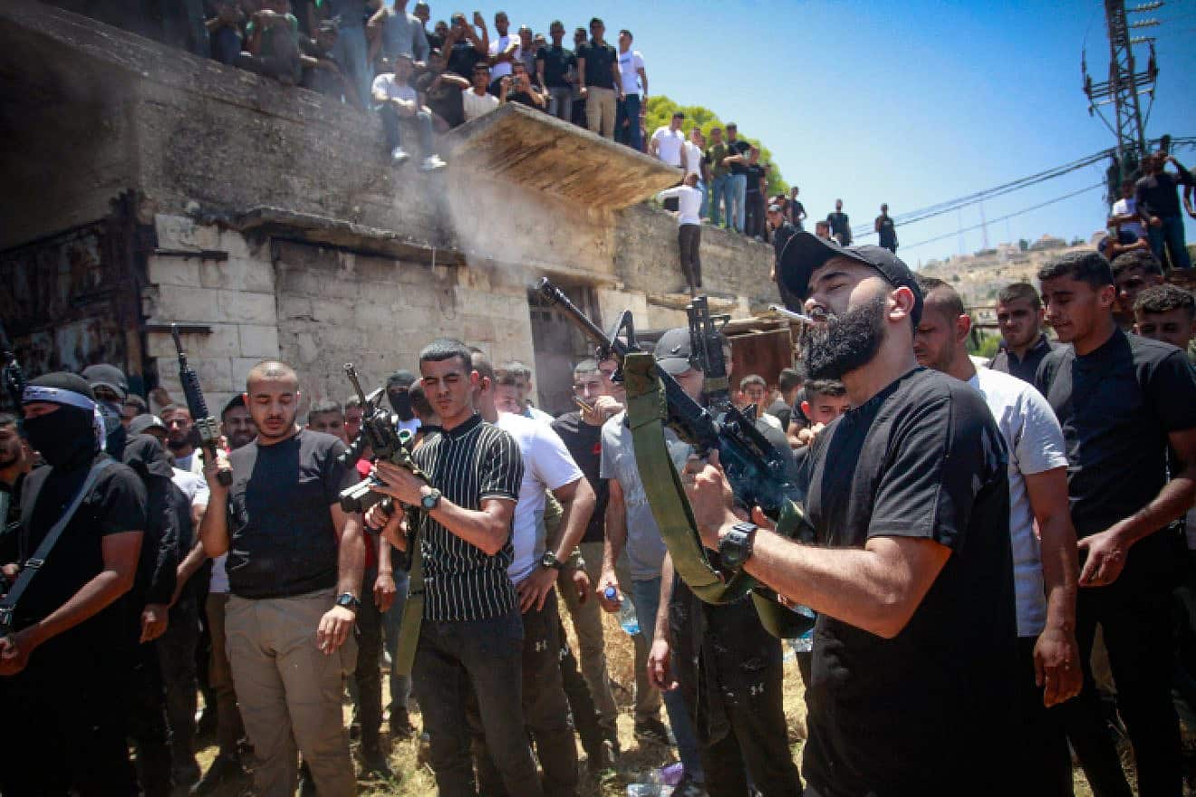 A Palestinian fires a rifle during the funeral in Jenin of terrorists killed during an IDF raid, July 5, 2023. Photo by Nasser Ishtayeh/Flash90.