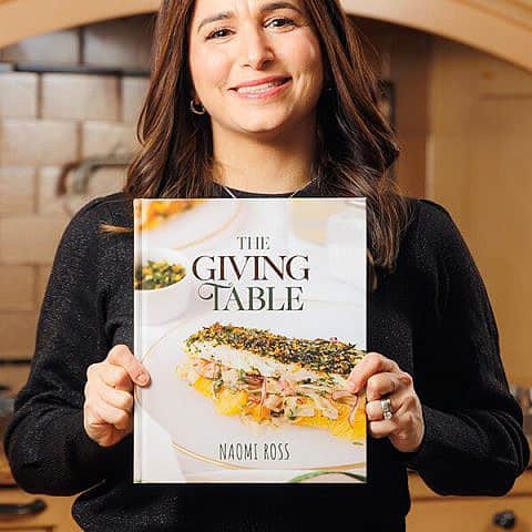 Naomi Ross with her cookbook, “The Giving Table." Credit: Courtesy.