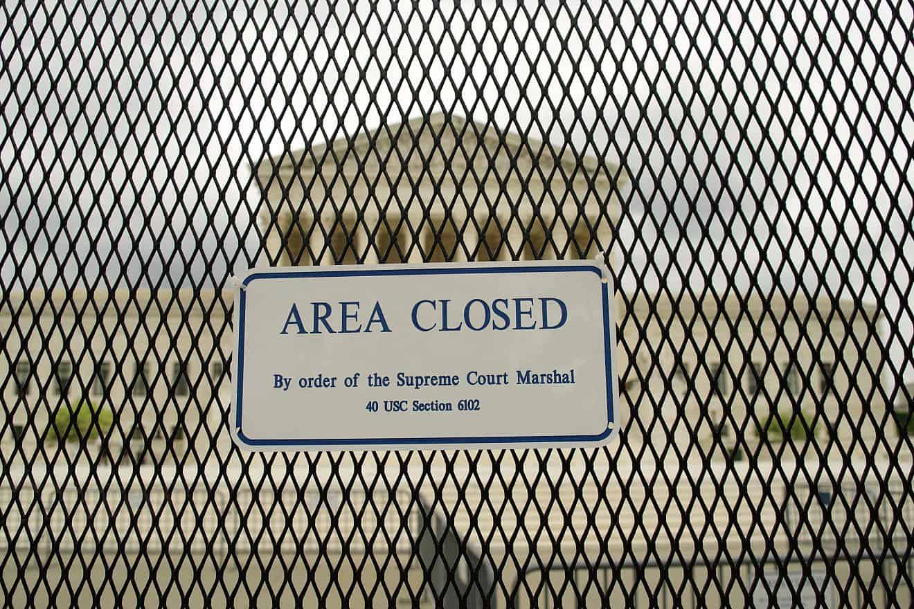 A security fence protefcting the U.S. Supreme Court on May 5, 2022, amid protests over the possible overturning of "Roe v Wade." Photo by Philip Yabut/Shutterstock.