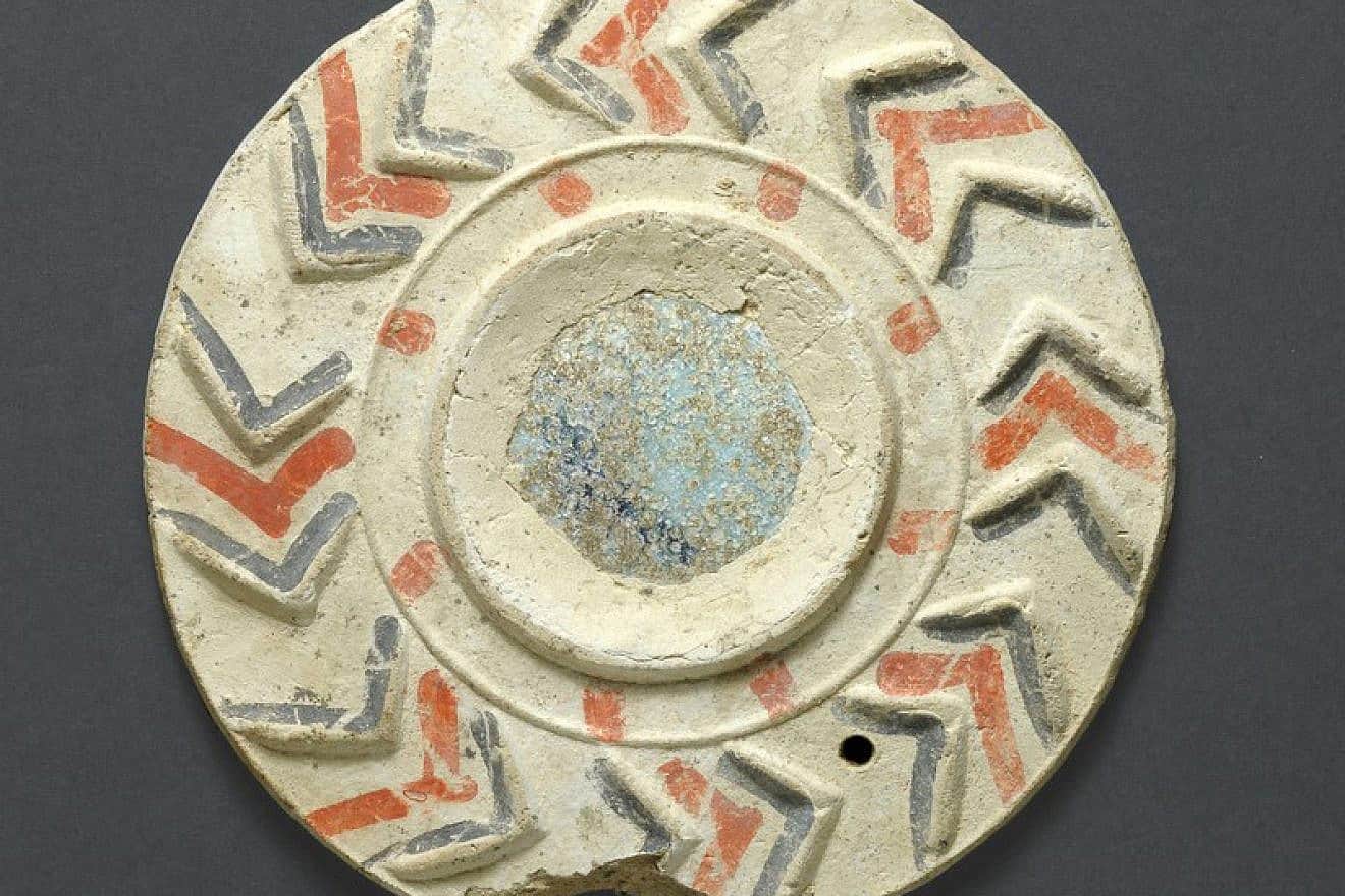 An almost complete mirror plaque found in the past at Nizzana in the Negev, Israel. Photo by Clara Amit, Israel Antiquities Authority.