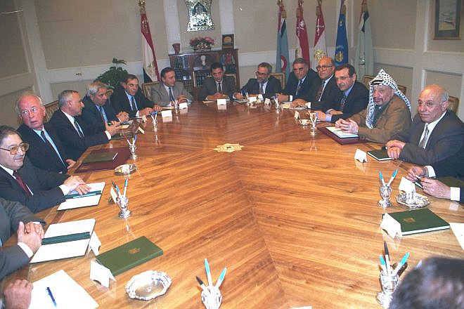 Prime Minister Yitzhak Rabin and the Israeli delegation meeting in Cairo with PLO Chairman Yasser Arafat and the Palestinian Delegation, Dec. 12, 1993. Credit: Tsvika Israeli/GPO.