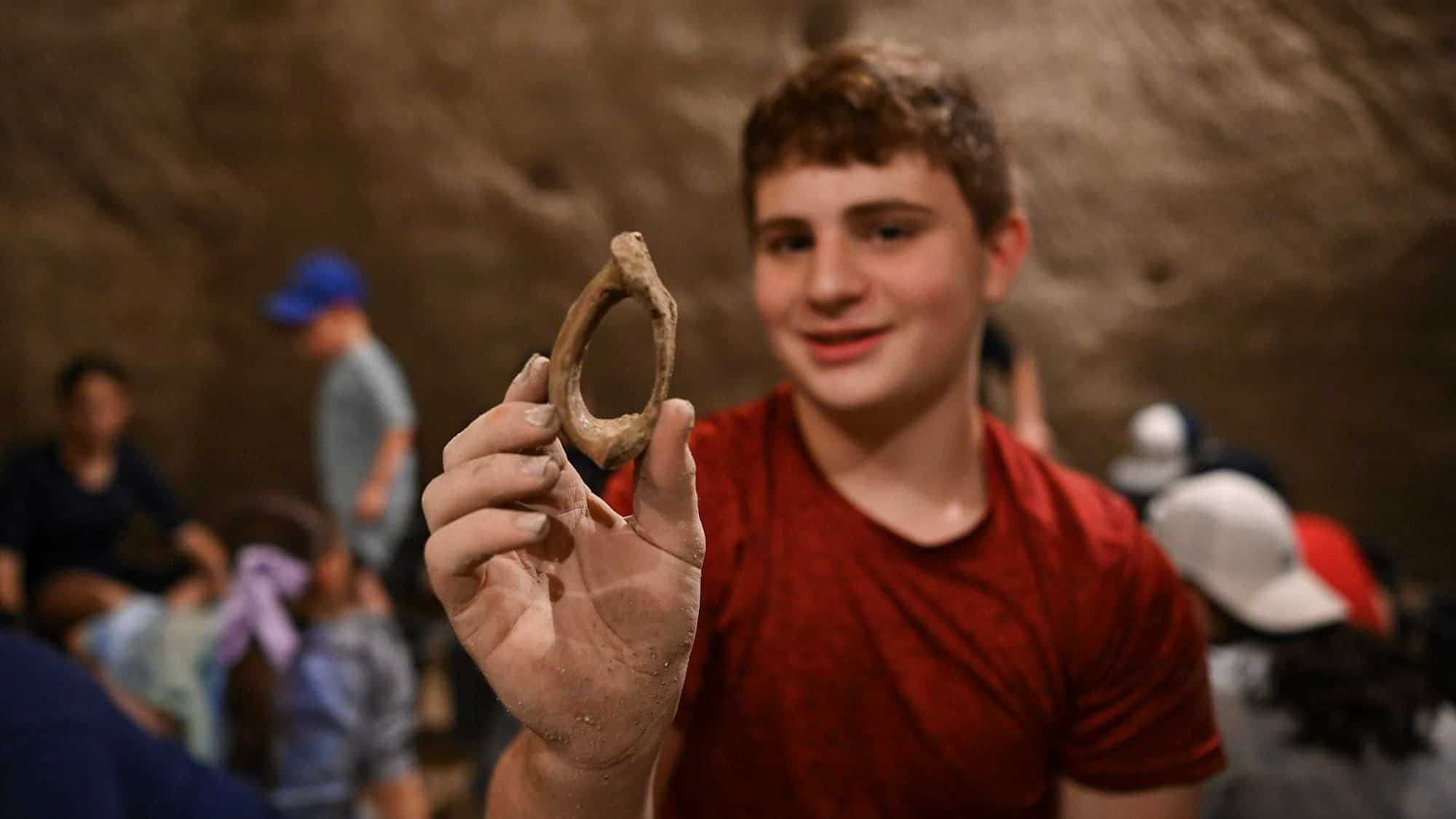 Kids participate in an archeological dig at Tel Maresha in Beit Guvrin, a UNESCO World Heritage Site in Israel’s Lachish region, Aug. 7, 2023. Photo by Yoav Dudkevitch/TPS.