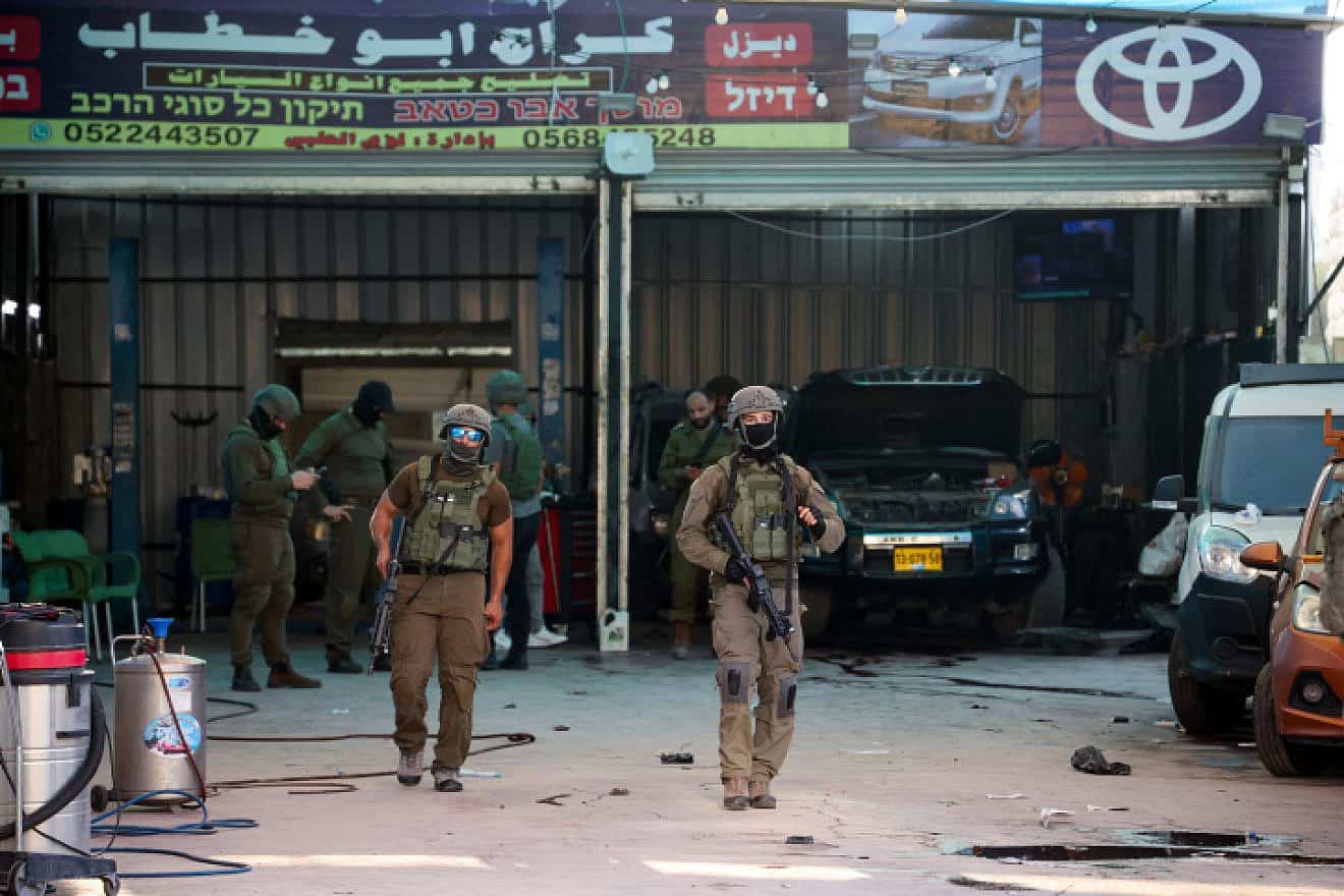 Israeli security forces secure the scene of a shooting attack in Hawara, in Samaria, near Nablus, Aug. 19, 2023. Photo by Flash90.