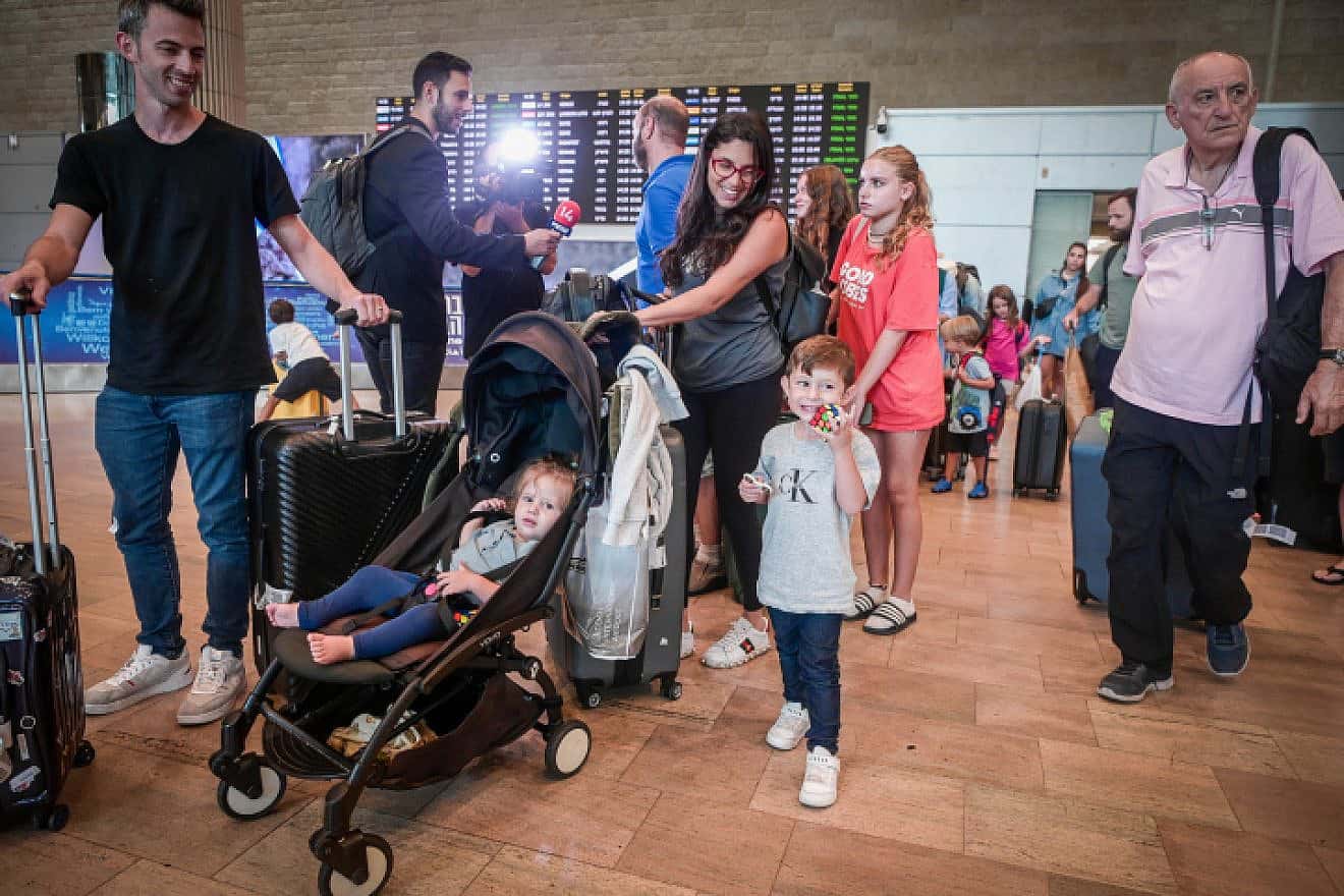 Israelis who were on the plane that landed in Saudi Arabia are seen after their arrival at Ben-Gurion Airport, Aug. 29, 2023. Photo by Avshalom Sassoni/Flash90.