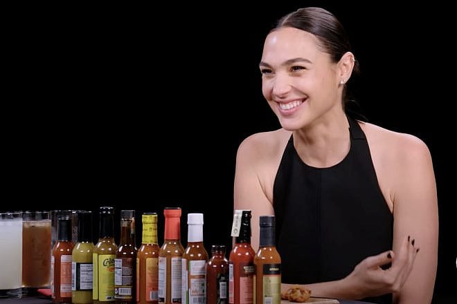 Israeli actress Gal Gadot early on in a 10 spicy chicken-wing interview on the show “Hot Ones.” Credit: YouTube.