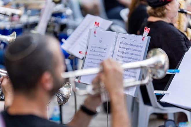 An orchestra plays for passers-by on a Jerusalem street, Aug. 21, 2022. Photo by Yosef Mizrahi/TPS.