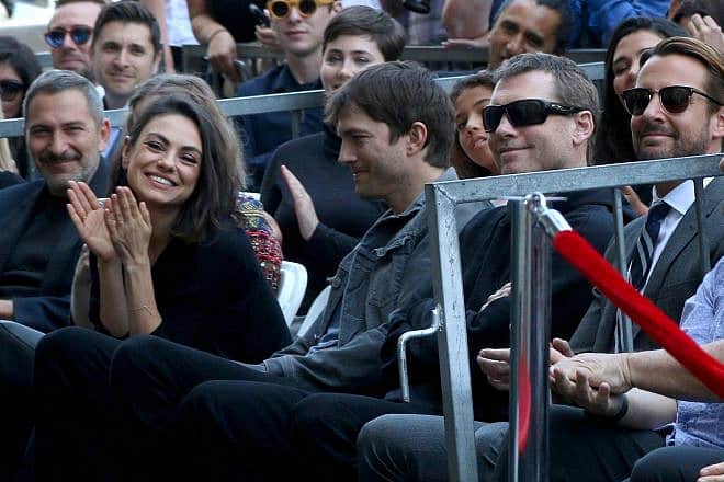 Actors Mila Kunis, Ashton Kutcher and Sam Worthington at the Zoe Saldana Star Ceremony on the Hollywood Walk of Fame in Los Angeles on May 3, 2018. Credit: Kathy Hutchins/Shutterstock.com.