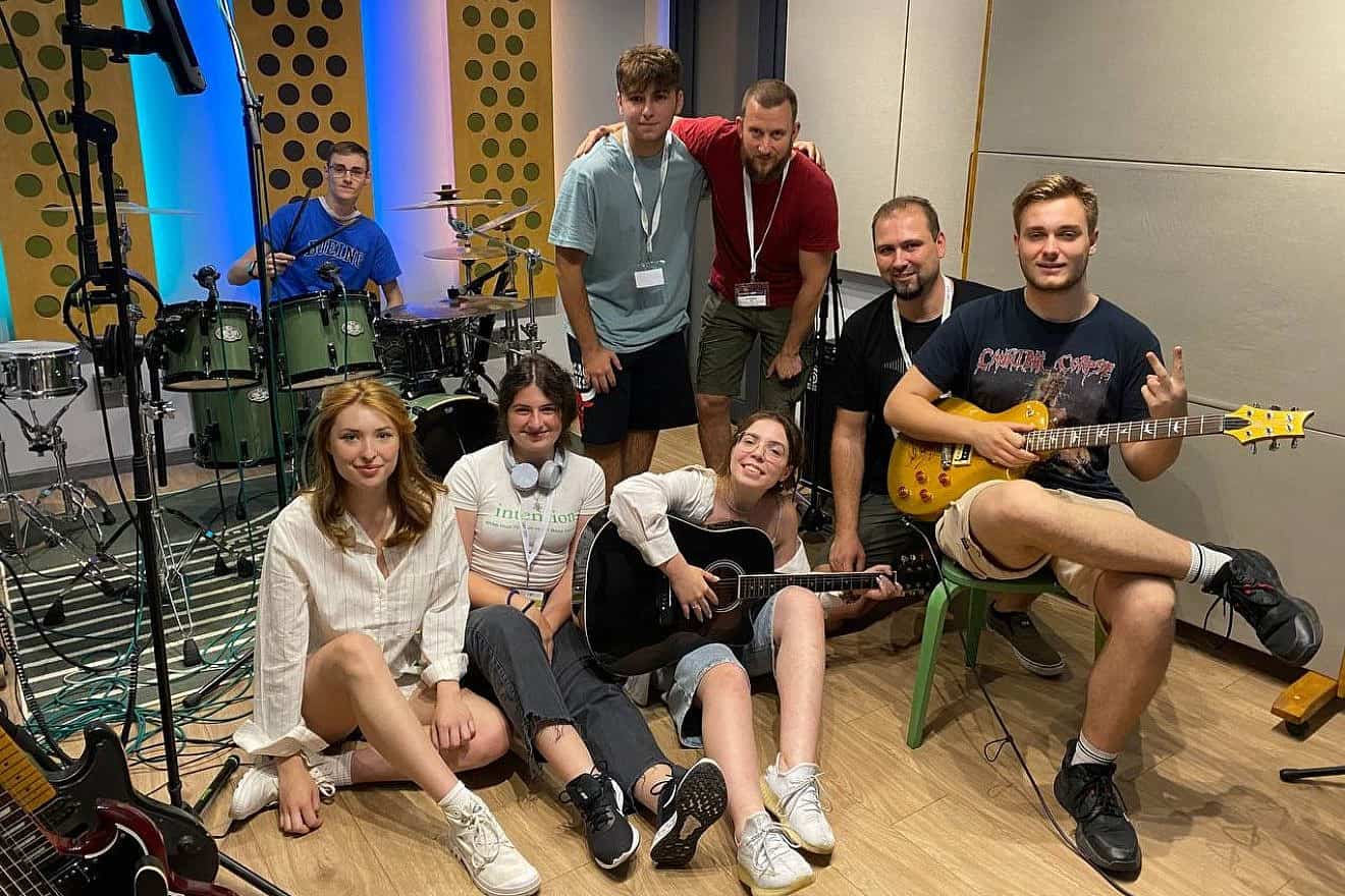 Polina Tymofieieva (seated, center) with friends at a summer school in Bulgaria, where she recorded her own music as part of a two-week program, August 2023. Credit: World ORT.