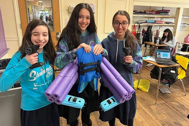 Students from Shulamith School in Cedarhurst, N.Y., use grant money secured by Teach NYS for engineering competitions to create innovations such as a flotation device for children that is operated via remote control by a parent. Credit: Courtesy.