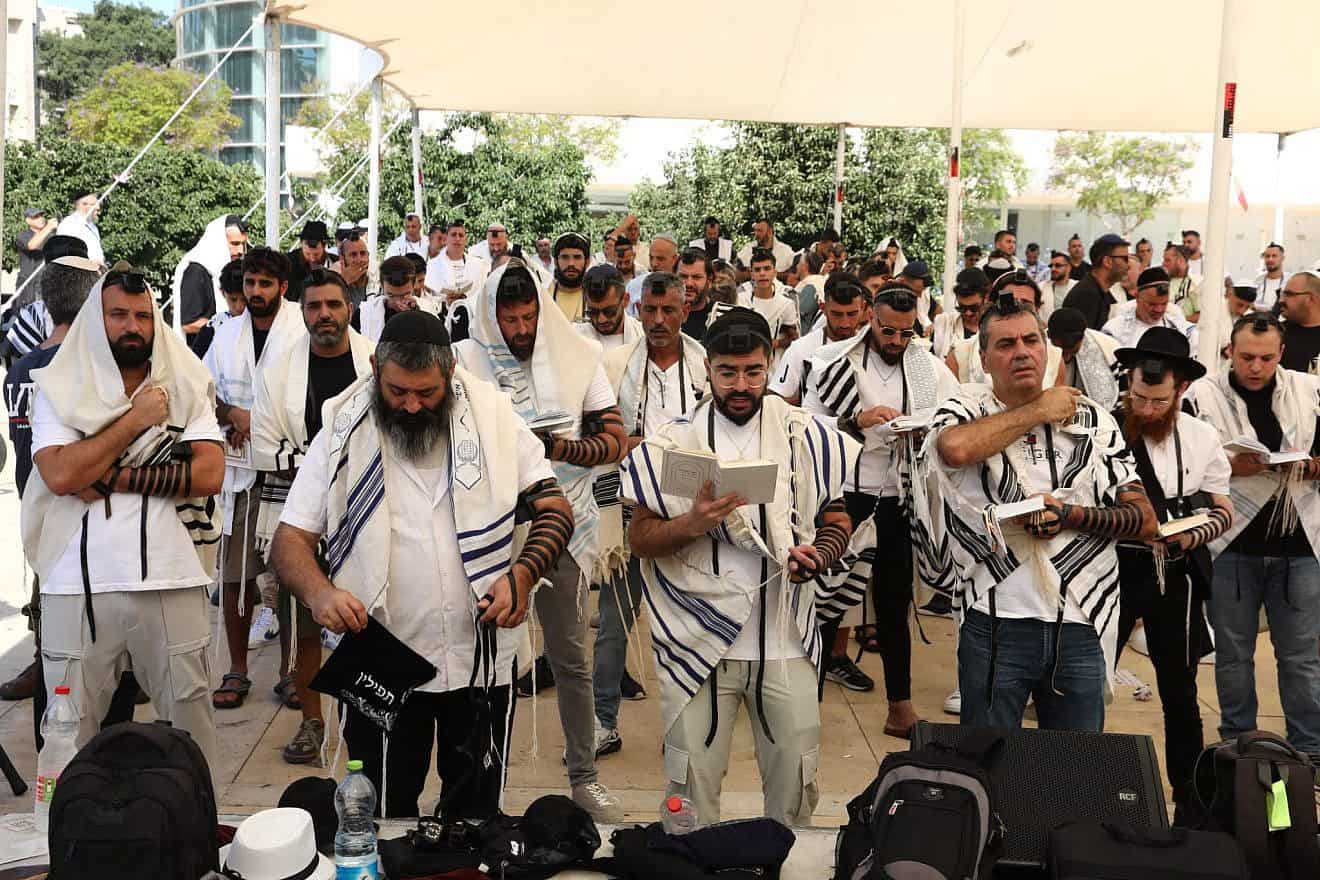 Jews participating in morning prayers at Tel Aviv's Habima Square, Aug. 2, 2023. Photo by Gideon Markovich/TPS.