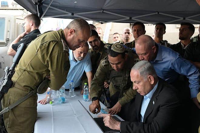 Israeli Prime Minister Benjamin Netanyahu and Defense Minister Yoav Gallant at the site of a terrorist attack in the South Hebron Hills in Judea, Aug. 21, 2023. Credit: PMO.