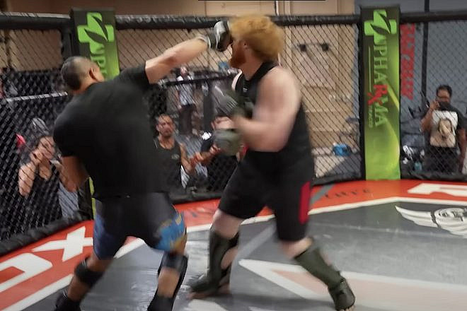 Jewish fighter Natan Levy (left) takes a swing at "Ben," representing a Holocaust denier and white supremacist. Source: YouTube screenshot.