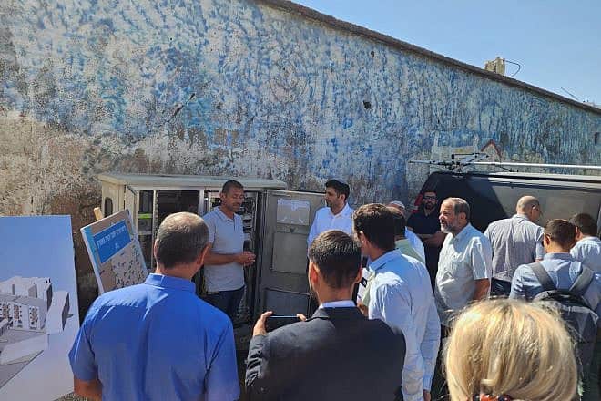 Israeli Communications Minister Shlomo Karhi  (background, center right) attends a ceremony in Hebron marking the connection of the city to a fiber-optic cable network, Aug. 22, 2023. Credit: Courtesy.