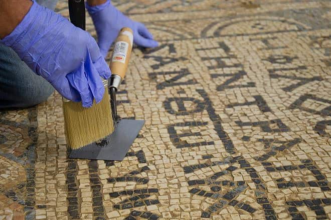 Conservation work on the mosaic at Megiddo Prison. Photo by Yaniv Berman/Israel Antiquities Authority.
