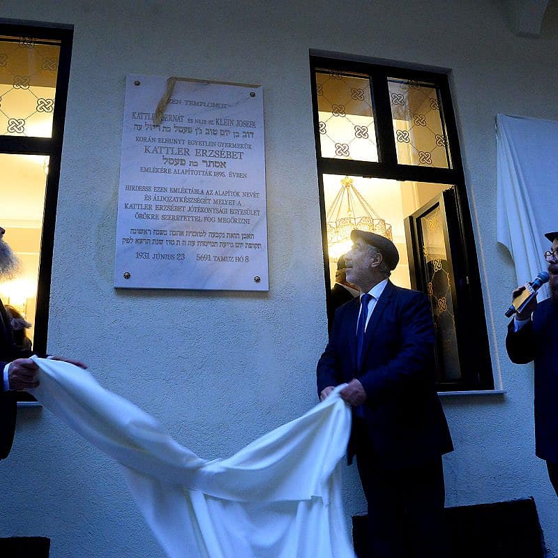 Community members unveil a plaque at the reopening of the Ohel Ezster synagogue in Budapest, Sept. 5, 2023. Photo by Zsolt Demecs.