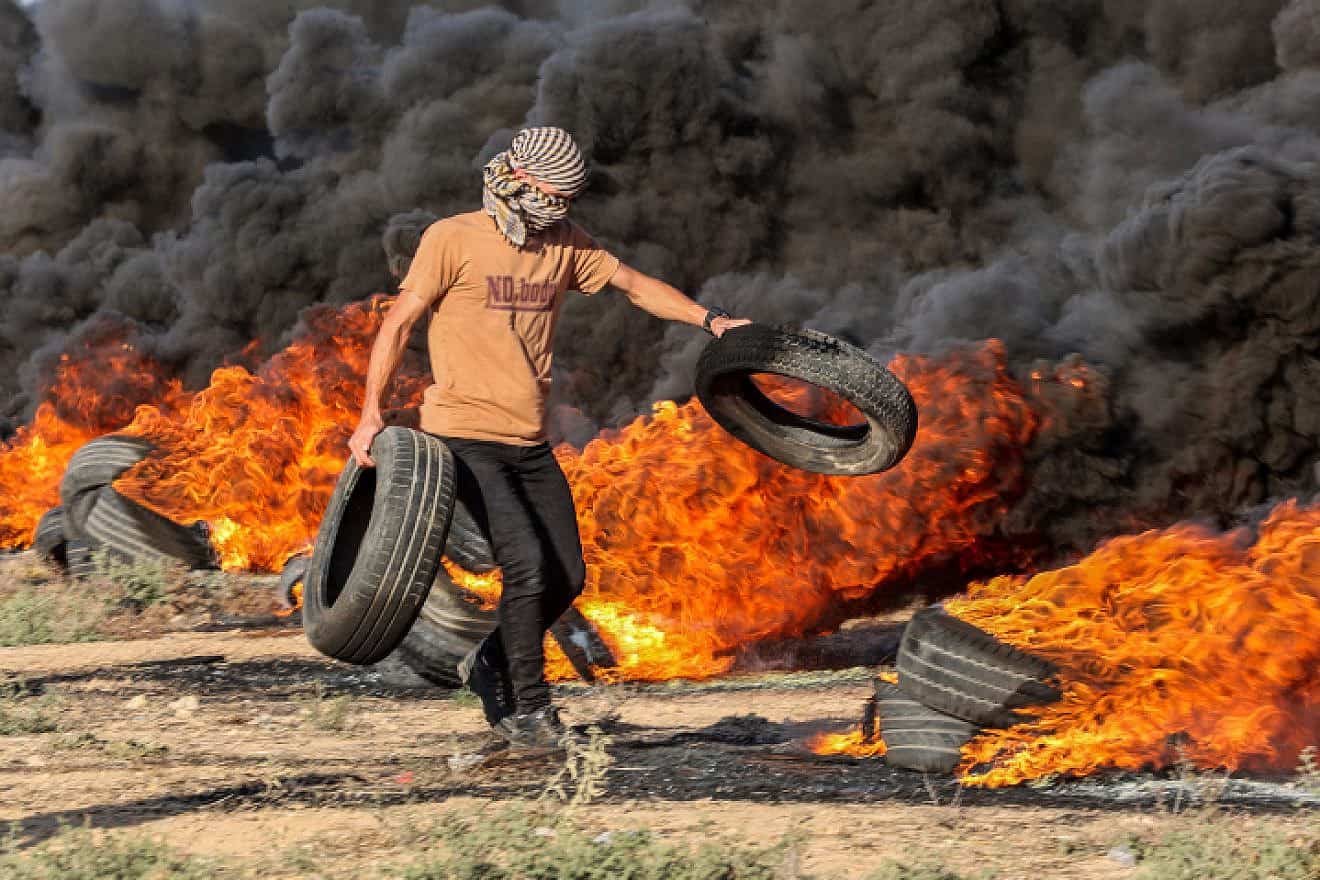 Palestinian protesters gather during a demonstration along the border fence with Israel, east of Gaza City, on Sept. 18, 2023. Photo by Atia Mohammed/Flash90.