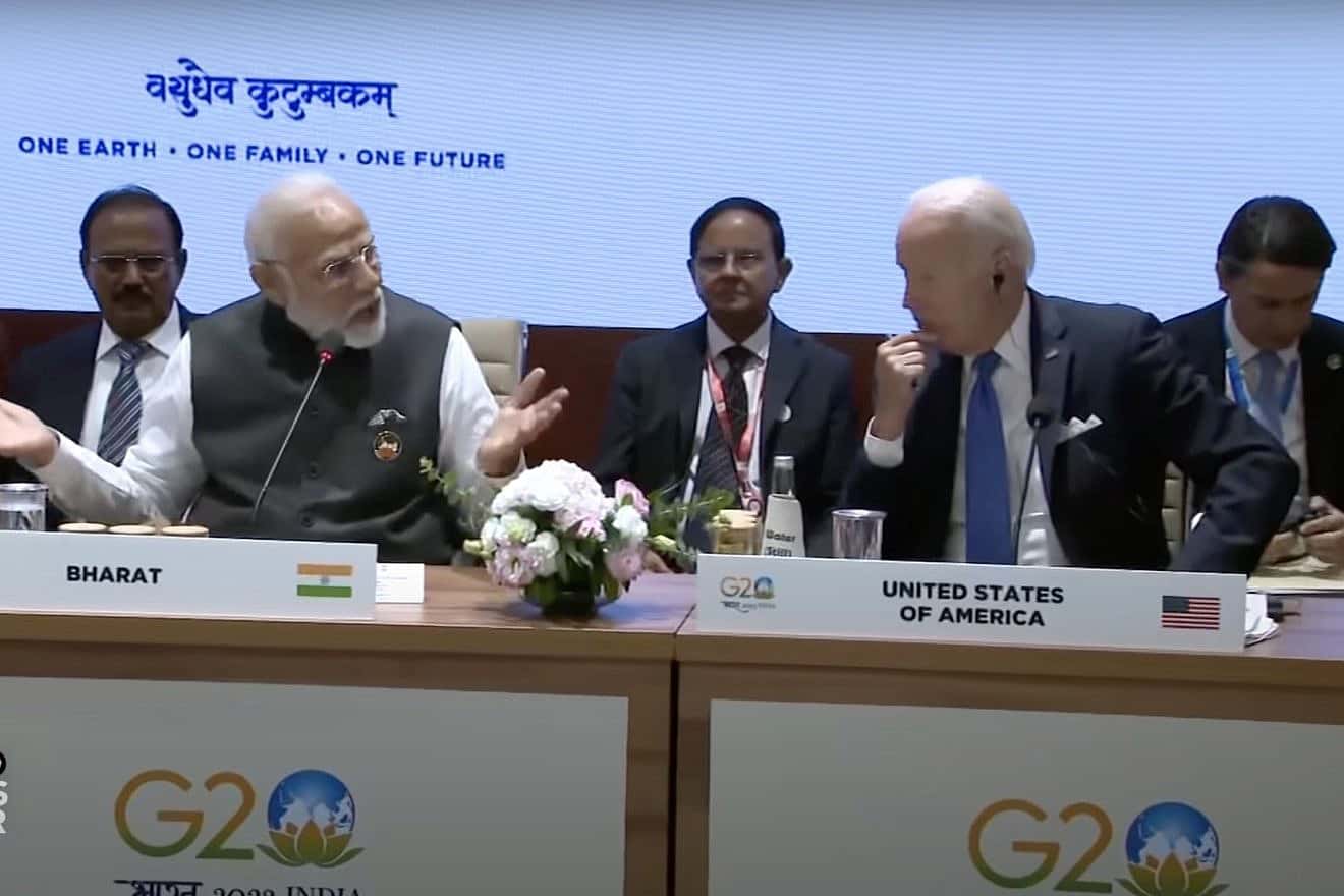 Narendra Modi (with outstretched arms), Indian prime minister, announces a new economic corridor connecting India, the Middle East and Europe as U.S. President Joe Biden (hand to his chin) at the G20 meeting in New Delhi on Sept. 9, 2023. Source: PBS NewsHour/YouTube screenshot.