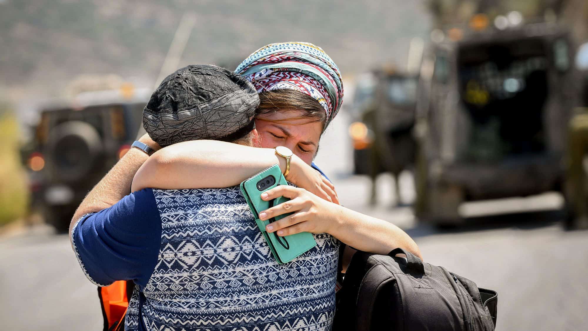 Women at the scene of a terrorist attack near Danny Spring, or Ein Bubin, in the Binyamin region of Samaria on Aug. 23, 2019. A father and his two children were seriously wounded when a grenade or improvised explosive device was thrown at them. Credit: Flash90.