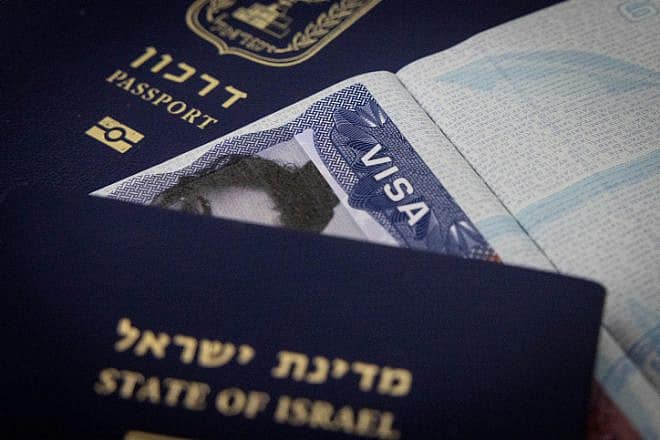 Illustration of passports and a travel visa. Sept. 23, 2023. Photo by Chaim Goldberg/Flash90.