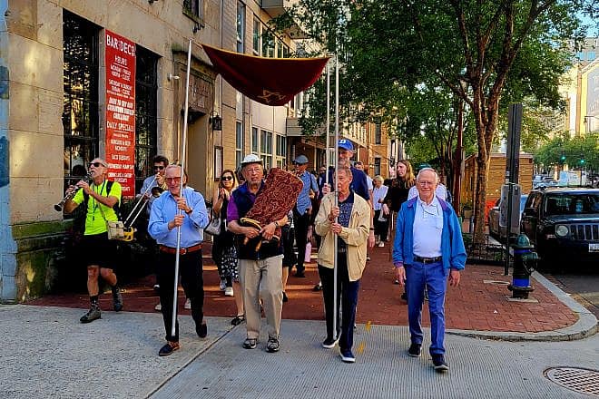 One of Washington’s oldest Torah scrolls is paraded through downtown Washington, D.C., to the Lillian and Albert Small Capital Jewish Museum, where it will be on permanent loan, Oct. 4, 2023. Photo by Betty Adler.