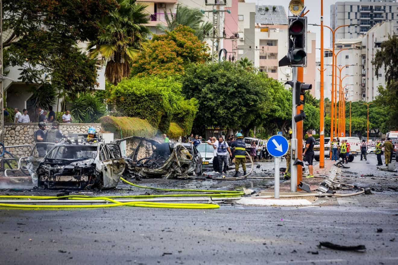 Security and rescue personnel at the scene where a Gazan rocket hit apartment buildings and cars in Ashdod on Oct. 9, 2023. Photo by Liron Moldovan/Flash90.