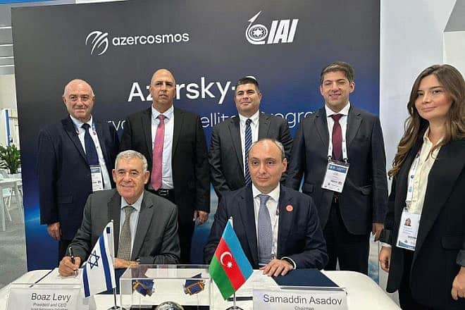IAI President and CEO, Boaz Levy (left) and Samaddin Asadov, chairman of the board of Azercosmos, sign a cooperation agreement for the sale of two advanced IAI satellites to Azerbaijan, on Oct. 3, 2023. Credit: IAI.