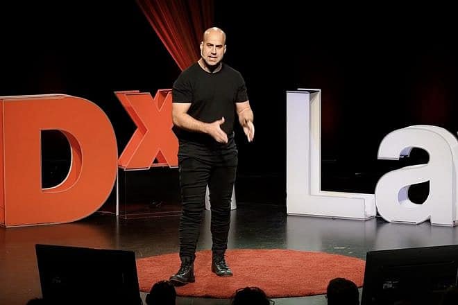 Corey Fleischer, of the Erasing Hate movement, speaks at a TEDxLaval event in Quebec in 2018. Source: YouTube/TedX Talks.