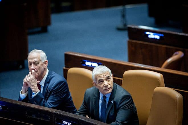 Then-Defense Minister Benny Gantz (left) and then-Prime Minister Yair Lapid during a vote at the Knesset in Jerusalem, Dec. 13, 2022. Photo by Yonatan Sindel/Flash90.