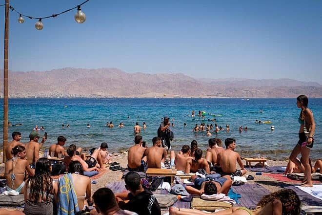 Israelis crowd a beach at Eilat on the Red Sea, Aug. 9, 2023. Photo by Noam Revkin Fenton/Flash90.