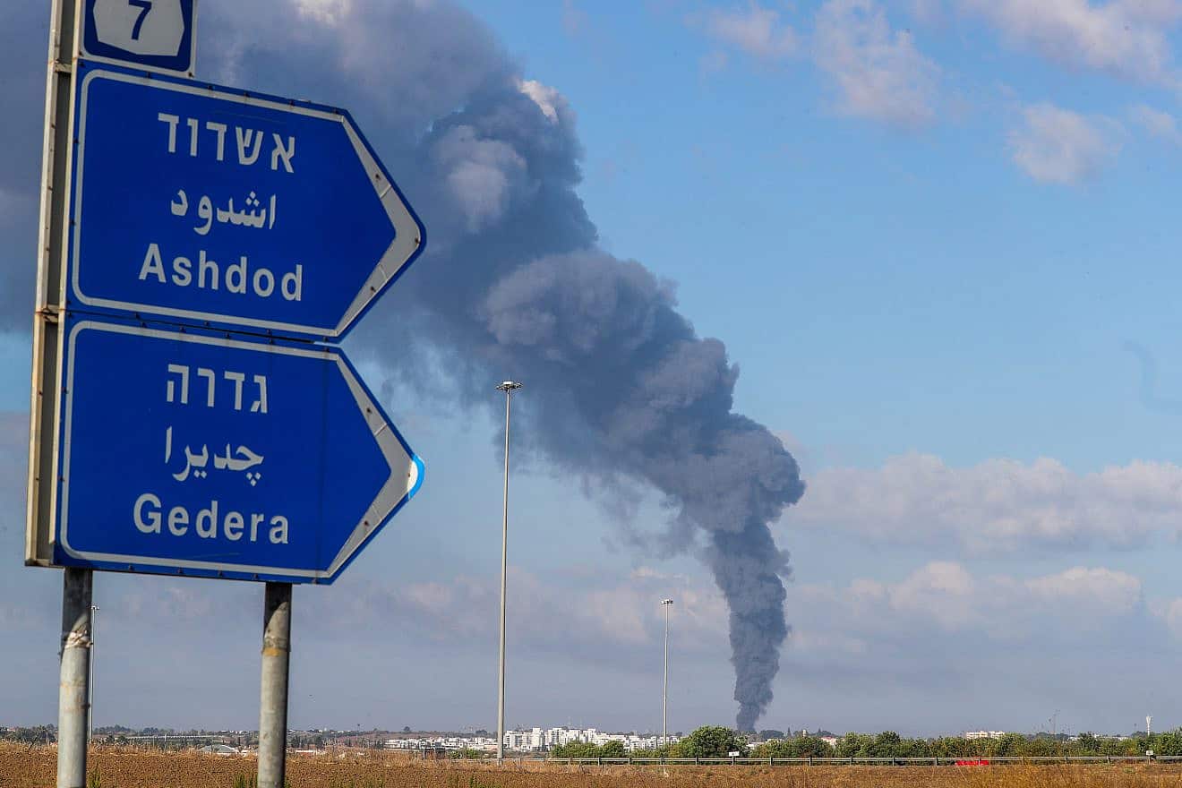 Smoke rises after a rocket fired from the Gaza Strip hit Ashdod, Oct. 7, 2023. Photo by Jamal Awad/Flash90.