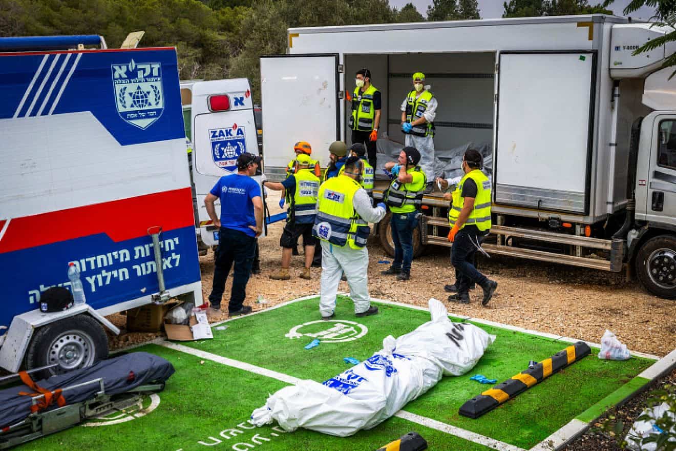 ZAKA emergency response personnel remove the corpses of civilians near Israel's border with Gaza murdered by Hamas terrorists, Oct. 9, 2023. Photo by Yossi Aloni/Flash90.