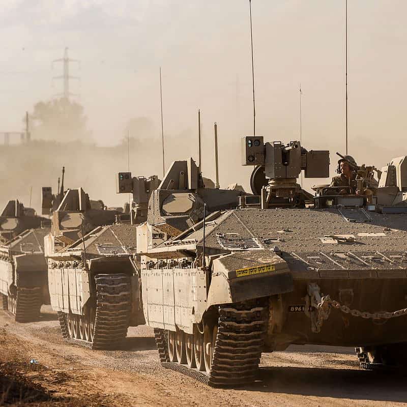 A convoy of military vehicles seen near Israel's border with the Gaza Strip, Oct. 15, 2023. Photo by Chaim Goldberg/Flash90.