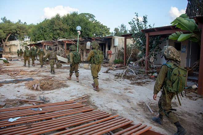 Israeli soldiers in Kfar Aza, a kibbutz near the Israeli-Gaza border, on Oct. 15, 2023. Photo by Edi Israel/Flash90.