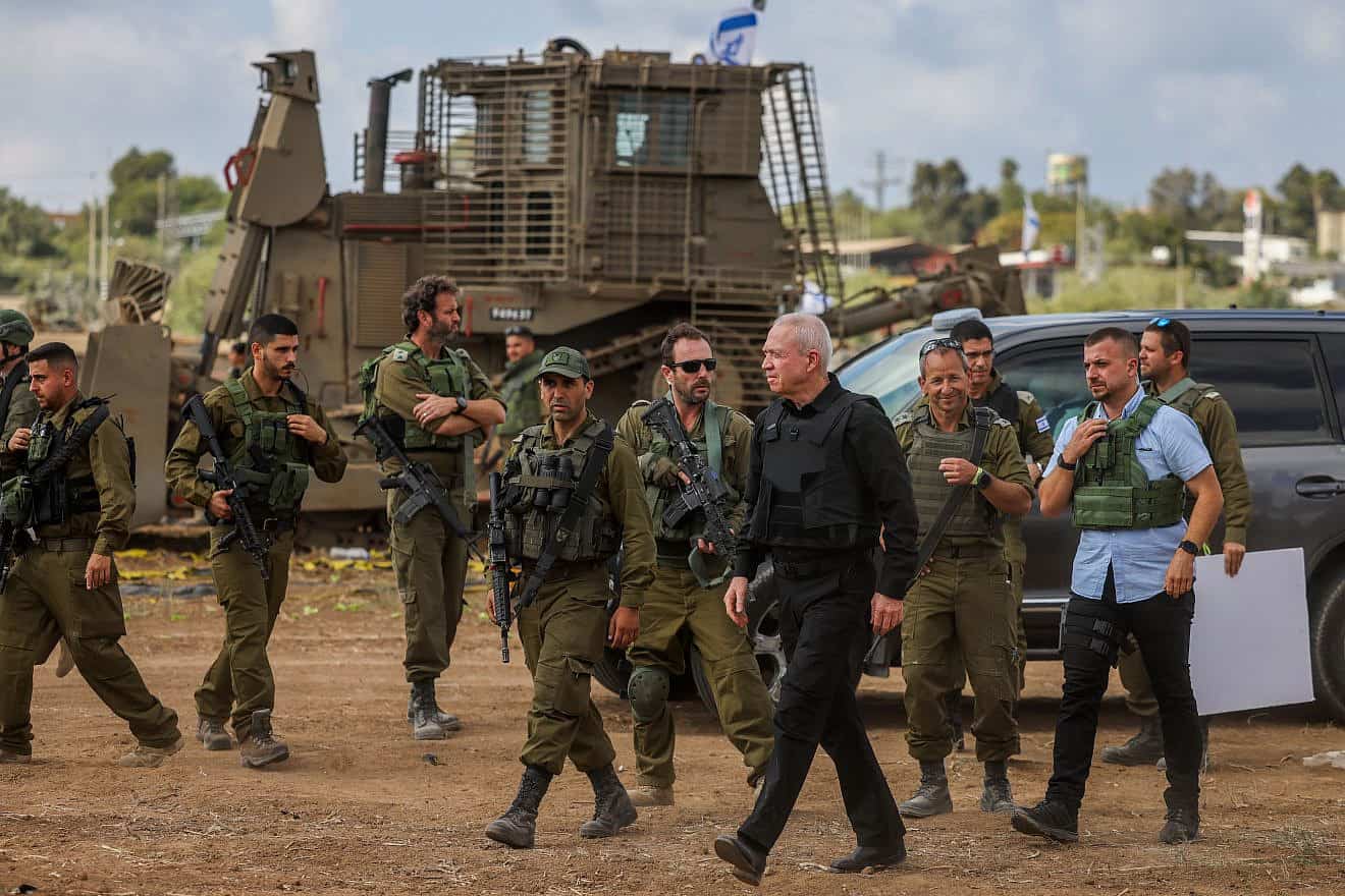 Israeli Defense Minister Yoav Gallant speaks with soldiers at a staging area near the Gaza Strip, Oct. 19, 2023. Photo by Chaim Goldberg/Flash90.