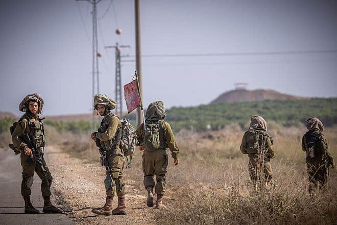 Infantrymen from the IDF's Netzah Yehuda Battalion patrol near the Gaza border, Oct. 20, 2023. Photo by Yonatan Sindel/Flash90.