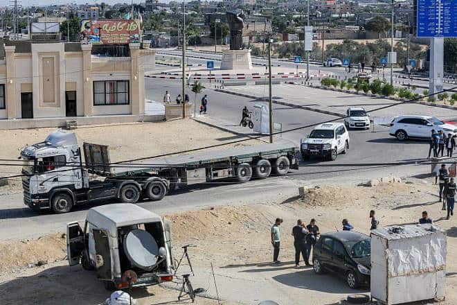 U.N. vehicles and empty trucks wait for the arrival of aid on the Gaza side of the Rafah border crossing with Egypt, Oct. 21, 2023. Photo by Atia Mohammed/Flash90.