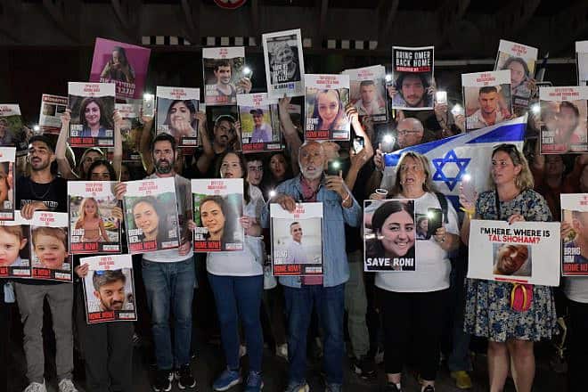 Families of those held hostage by Hamas terrorists in the Gaza Strip hold photos of their loved ones during a protest outside of the Tel Aviv Museum of Art on Oct. 21, 2023. Photo by Tomer Neuberg/Flash90.