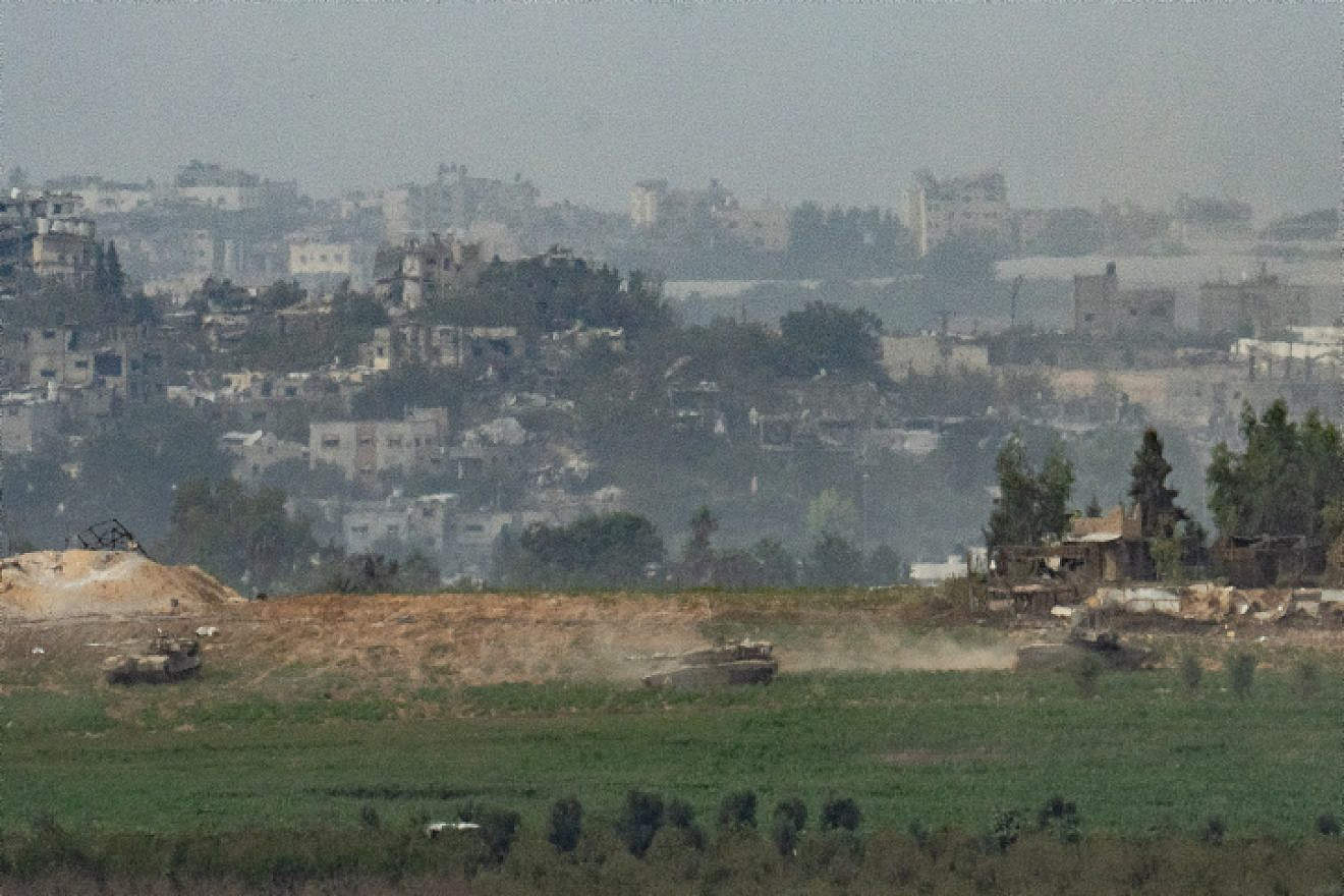 Israeli tanks in the Gaza Strip, as seen from the Israeli side of the border, on Oct. 29, 2023. Photo by Erik Marmor/Flash90.