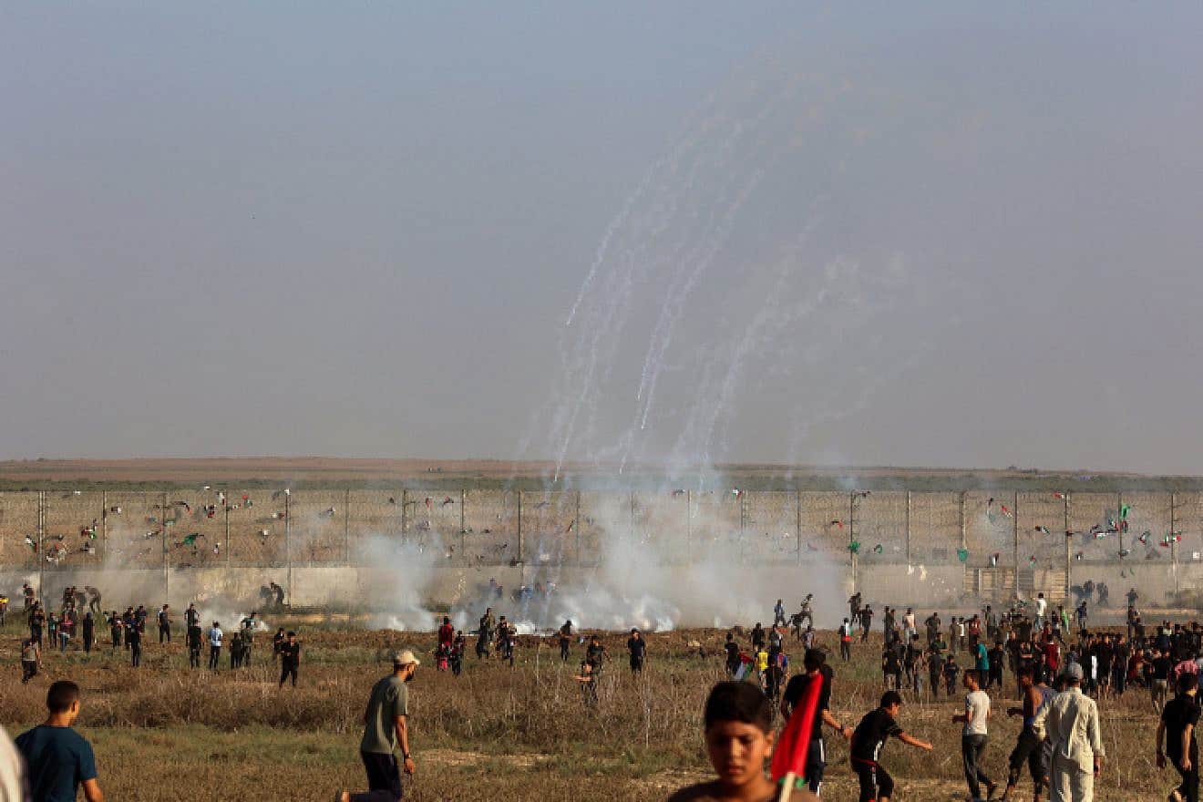 Palestinians riot at the Israeli border fence, east of Gaza City on Aug. 21, 2023. Photo by Atia Mohammed/Flash90.