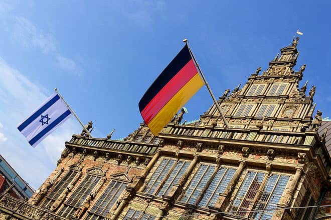 Israeli and German flags flying from the historic city hall in Bremen, Germany. Credit: Harald Schmidt/Shutterstock.