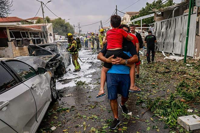The scene where a rocket fired from the Gaza Strip by Palestinian militants hit a building and cars in the southern Israeli city of Ashkelon on Oct. 9, 2023. Photo by Chaim Goldberg/Flash90.