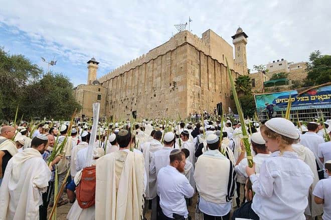 Jews celebrate the week-long holiday of Sukkot at the Tomb of the Patriarchs in Hebron, Oct. 3, 2023. Photo by Eytan Schweber/TPS.