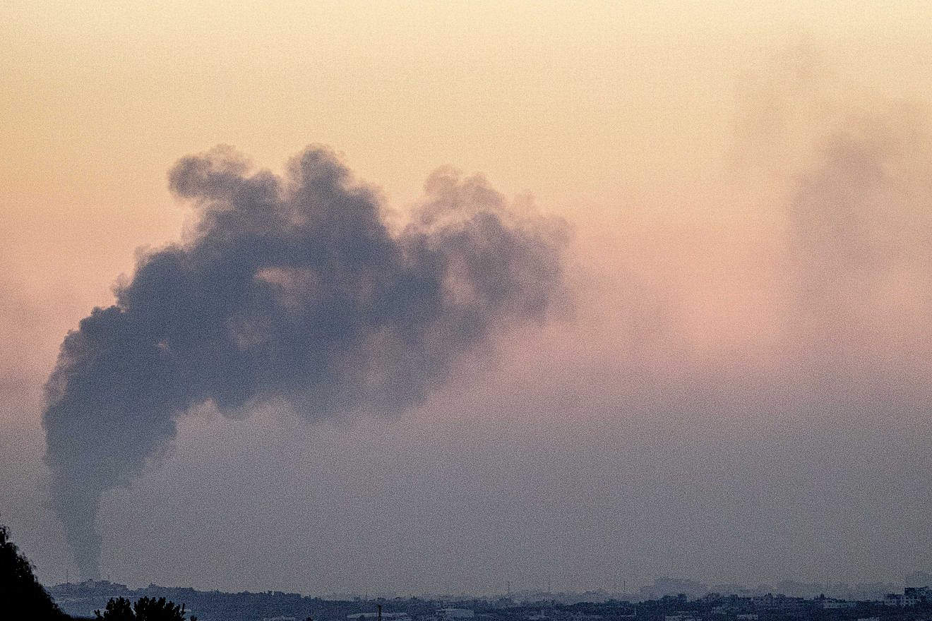 Smoke rises after an Israeli airstrike in the Gaza Strip, as seen from the Israeli side of the border, on Oct. 30, 2023. Photo by Chaim Goldberg/Flash90.