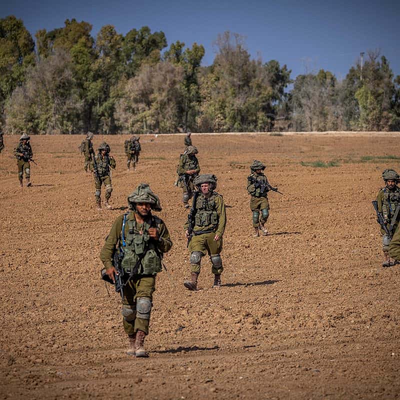 Israeli soldiers from the Netzah Yehuda Battalion patrol near the border with the Gaza Strip, Oct. 20, 2023. Photo by Yonatan Sindel/Flash90.
