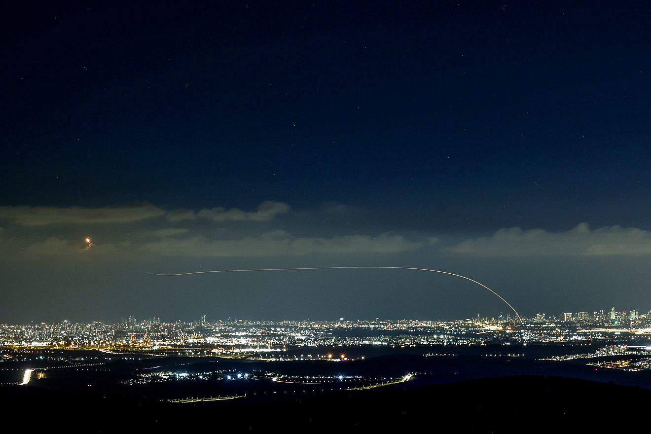 Iron Dome air-defense system fires interception missiles as rockets fired from the Gaza Strip to Israel, as it seen from Moshav Neve Ilan in central Israel on Oct. 18, 2023. Photo by Chaim Goldberg/Flash90.