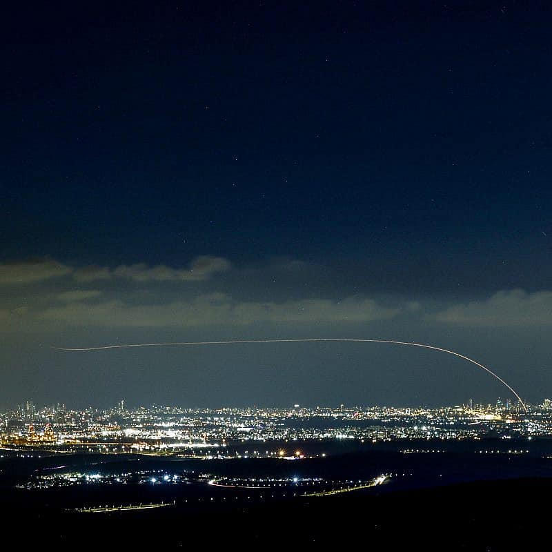 Iron Dome air-defense system fires interception missiles as rockets fired from the Gaza Strip to Israel, as it seen from Moshav Neve Ilan in central Israel on Oct. 18, 2023. Photo by Chaim Goldberg/Flash90.