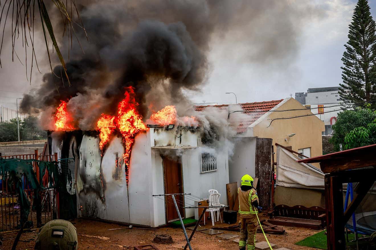 Israeli security forces at the scene where a rocket fired from the Gaza Strip hit a shelter in the southern Israeli city of Sderot, Oct. 9, 2023. Photo by Yossi Zamir/Flash90.