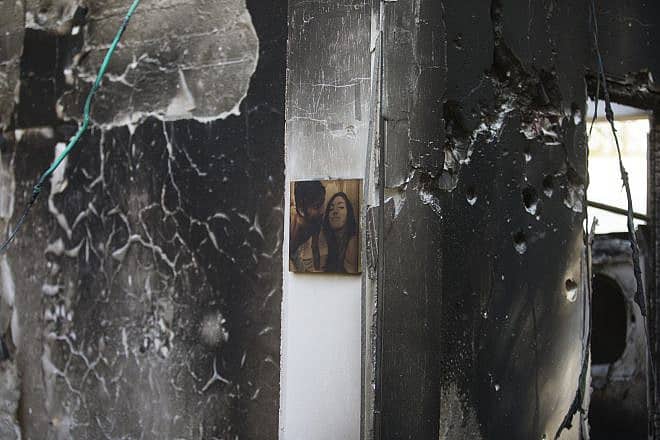 A single photograph of a couple remains on the wall of a bullet-riddled home in Kfar Aza in southern Israel after Hamas terrorists rampaged through the community on Oct. 7, murdering families and taking civilians hostage, Oct. 16, 2023. Photo by Rina Castelnuovo.