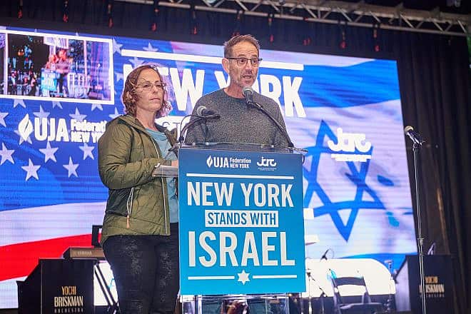 Ronen and Orna Neutra speak about their 21-year-old son, Omer, who is believed to be held by Hamas at the “New York Stands for Israel” rally and vigil on Oct. 10, 2023. Credit: Perry Bindelglass/JCRC.